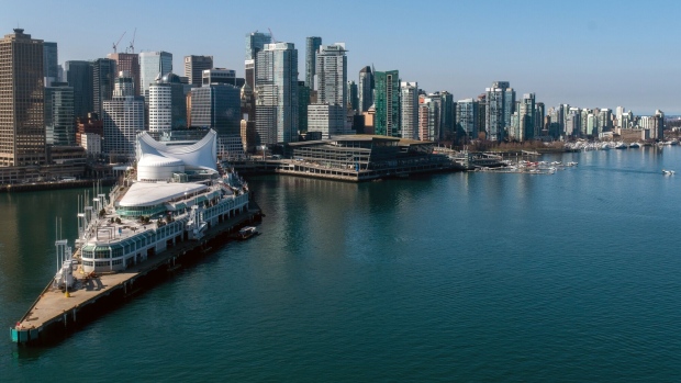 The Vancouver skyline and cruise ship terminal, left, in Vancouver, British Columbia, Canada, on Wednesday, March 22, 2023. Canada is scheduled to release gross domestic product (GDP) figures on March 31. Photographer: James MacDonald/Bloomberg