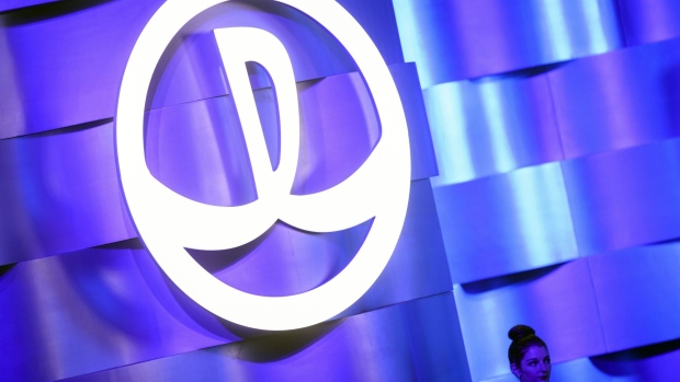 The Dalian Wanda Group Co. logo is displayed at an event in Los Angeles, California, U.S., on Monday, Oct. 17, 2016. Billionaire Wang Jianlin unveiled subsidies worth more than $150 million a year to lure film makers to his new studio complex in China's coastal city of Qingdao. Photographer: Patrick T. Fallon/Bloomberg