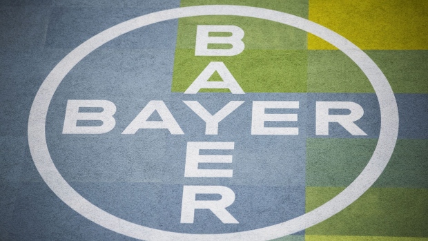 A logo sits on display at the Bayer CropScience AG facility in Monheim, Germany, on Wednesday, March 21, 2018. Bayer cleared one big hurdle for its $66 billion takeover of Monsanto, winning European Union approval for the deal after agreeing to bolster BASF SE by selling it seeds, pesticides and digital agriculture technology.