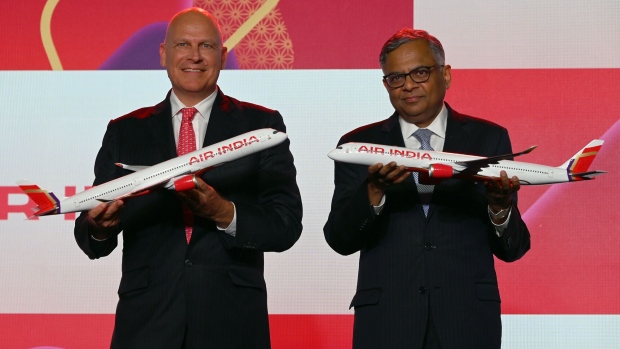 Campbell Wilson, left, and N. Chandrasekaran during an unveiling event for the carrier’s new look in New Delhi on Aug. 10.