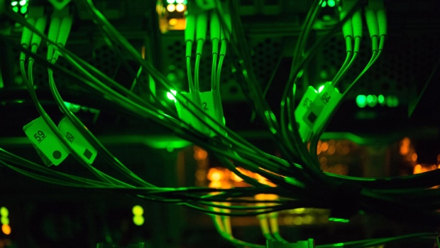 Green light illuminates optical cables connected to data rack servers in the server room of the Sberbank PJSC data processing center (DPC) at the Skolkovo Innovation Center, in Moscow, Russia, on Tuesday, Dec. 26, 2017. Sberbank PJSC, Russia’s most valuable company, will boost its dividend payout to 50 percent of profit or higher, just not as quickly as some investors had hoped. Photographer: Andrey Rudakov/Bloomberg