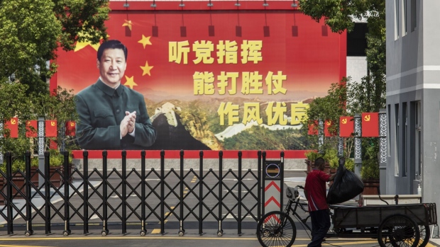 A billboard featuring President Xi in Shanghai. Photographer: Qilai Shen/Bloomberg