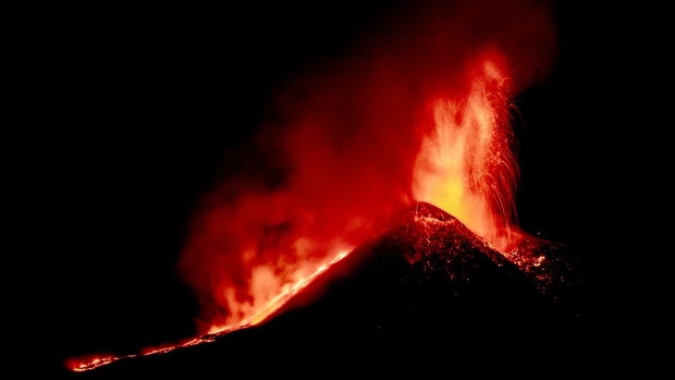 Lava erupts from Mount Etna in Catania, Italy, on Aug. 14. Photographer: Fabrizio Villa/Getty Images