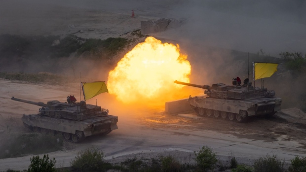 South Korean army K1A1 tanks, manufactured by Hyundai Rotem Co., fires during a joint live-fire exercise with U.S. army at the Seungjin Fire Training Center in Pocheon, South Korea, on Thursday, May 25, 2023. The US and South Korea began their largest-ever live-fire drills that will take place near the border with North Korea, which has threatened retaliation against the two nations it labels “war maniacs.” Photographer: SeongJoon Cho/Bloomberg