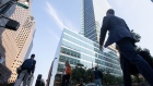 Office workers walk near the Goldman Sachs Group Inc. headquarters in New York, U.S., on Thursday, July 22, 2021. After a year of Zoom meetings and awkward virtual happy hours, New York's youngest aspiring financiers have returned to the offices of the city's investment banks, where they're making the most of the in-person mentoring and networking they've lacked during the pandemic. Photographer: Michael Nagle/Bloomberg