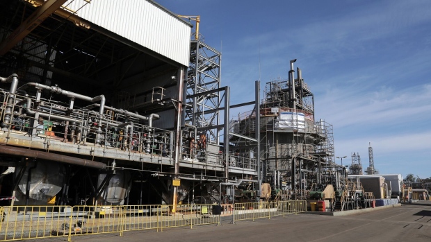 A reduction autoclave, foreground, used for in the process of manufacturing nickel briquettes and nickel powder, stands at the BHP Group Ltd. Kwinana Nickel Refinery in Kwinana, Western Australia, Australia, on Friday, Aug. 2, 2019. The world's biggest miners, including BHP Group and Glencore Plc, are finally firm believers in the electric vehicle battery revolution -- what they don't agree on is which metals will deliver the best long-term exposure to the developing global market. Photographer: Philip Gostelow/Bloomberg