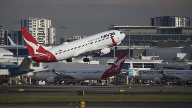 An aircraft operated by Qantas Airways Ltd. takes off from Sydney Airport in Sydney, Australia, on Tuesday, August 22, 2023. Qantas is scheduled to release earnings results on Aug. 24. Photographer Brent Lewin/Bloomberg Photographer: Brent Lewin/Bloomberg