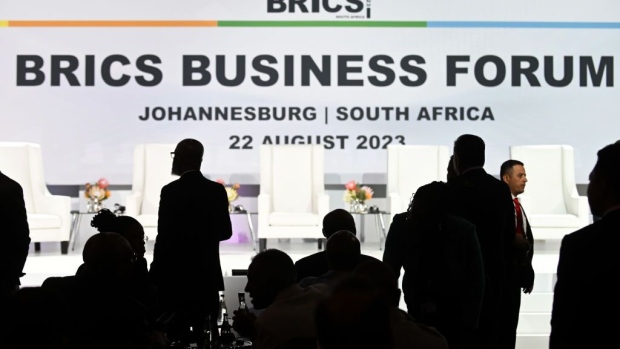 Delegates take their seats for the BRICS business forum on day one of the BRICS summit at the Sandton Convention Center in the Sandton district of Johannesburg, South Africa, on Tuesday, Aug. 22, 2023. Expansion of BRICS membership is top of the agenda for the summit being hosted this week by South Africa. Photographer: Bloomberg/Bloomberg