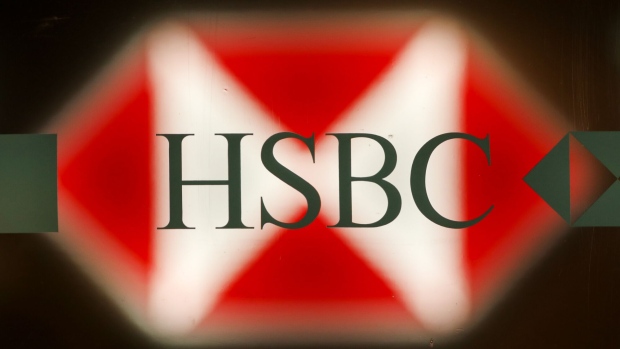 A logo sits on a HSBC Holdings Plc bank branch in London, U.K., on Tuesday, May 2, 2017. HSBC has appeased investors with $3.5 billion of share buybacks, but after five years of declining revenue analysts are looking for evidence the bank is stabilizing its top line when it reports earnings Thursday. Photographer: Luke MacGregor/Bloomberg