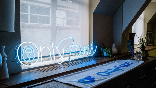 A neon OnlyFans Ltd. sign in the window of the company's offices in London, UK, on Friday, Oct. 4, 2022. OnlyFans executives have mapped out a plan to become more transparent and highlight less-explicit content at a time when the company’s home country is finalizing strict new online safety laws.