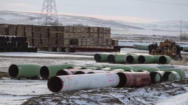 Pipes for the Keystone XL pipeline stacked in a yard near Oyen, Alberta, Canada, on Tuesday, Jan. 26, 2021.
