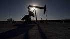 The silhouette of a pumpjack is seen in the Permian Basin near Orla, Texas, U.S., on Friday, March 2, 2018. Chevron, the world's third-largest publicly traded oil producer, is spending $3.3 billion this year in the Permian and an additional $1 billion in other shale basins. Its expansion will further bolster U.S. oil output, which already exceeds 10 million barrels a day, surpassing the record set in 1970.