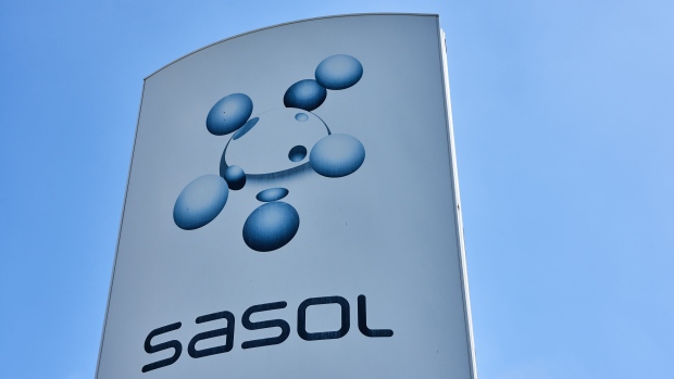 A sign at the Sasol Ltd. Sasol One liquid fuels facility in Sasolburg, South Africa, on Thursday, Feb. 24, 2023. Sasol, South Africa’s second-biggest producer of greenhouse gases, set a target of cutting its emissions of climate-warming pollutants by 30% by 2030 and said it aims to have net-zero emissions by 2050. Photographer: Waldo Swiegers/Bloomberg