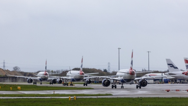 Passenger airplanes, operated by British Airways, at London Heathrow Airport. Photographer: Chris Ratcliffe/Bloomberg