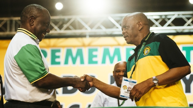 Cyril Ramaphosa, left, and Ace Magashule at an ANC conference. Photographer: Waldo Swiegers/Bloomberg