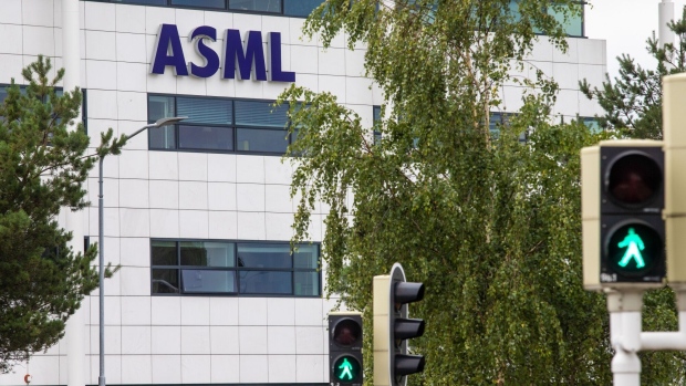 The ASML Holding NV logo on a building at their headquarters in Veldhoven, Netherlands, on Wednesday, July 19, 2023. ASML Holding NV’s orders rose in the second quarter on demand for chip-making machines in China, defying a slump in the semiconductor industry.