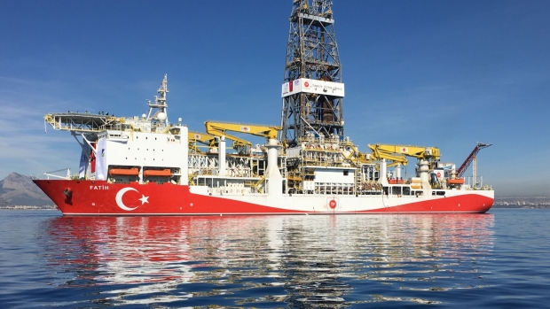 The Fatih oil drilling ship prepares to sail to the contested waters of the Mediterranean Sea for oil and gas drilling operations near Anatalya, Turkey, on Tuesday, Oct. 30, 2018. Turkey’s first deep-sea drilling ship, flanked by Turkish war vessels, set sail Tuesday looking for natural gas and oil in contested waters of the Mediterranean, a launch liable to exacerbate longstanding tensions with Greece.