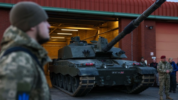Tank crews from Ukraine's armed forces being trained to use a Challenger 2 main battle tank by members of British Army prepare to meet Volodymyr Zelenskiy, Ukraine's president, and Rishi Sunak, UK prime minister, at Lulworth Camp, UK, on Wednesday, Feb. 8, 2023. UK forces trained 10,000 Ukrainian troops in 2022 and aims to assist at least 20,000 more this year, Sunak said in Parliament.