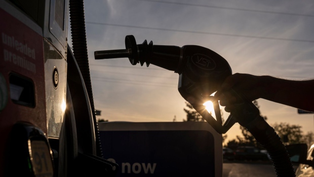 A driver holds a fuel nozzle at a gas station in Sacramento, California, U.S., on Thursday, March 24, 2022. California Governor Gavin Newsom is proposing to send car owners $400 debit cards and partially pause gasoline taxes to address high gas prices. Photographer: David Paul Morris/Bloomberg