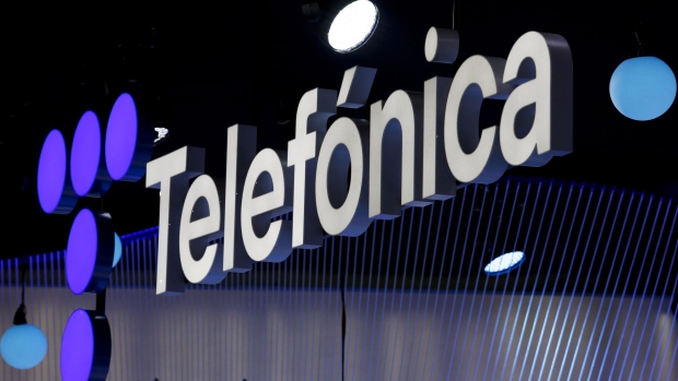 An illuminated logo above the Telefonica SA stand on the opening day of the MWC Barcelona at the Fira de Barcelona venue in Barcelona, Spain, on Monday, Feb. 28, 2022.  Photographer: Angel Garcia/Bloomberg