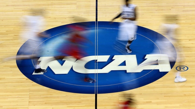 JACKSONVILLE, FL - MARCH 19: Mississippi Rebels and Xavier Musketeers players run by the logo at mid-court during the second round of the 2015 NCAA Men's Basketball Tournament at Jacksonville Veterans Memorial Arena on March 19, 2015 in Jacksonville, Florida. (Photo by Mike Ehrmann/Getty Images)