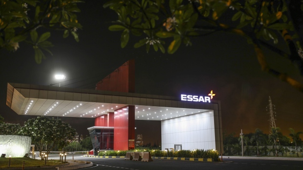 Essar Oil Ltd. signage is displayed at the main entrance to the Vadinar Refinery complex operated by Nayara Energy Ltd., formerly known as Essar Oil Ltd. and now jointly owned by Rosneft Oil Co. and Trafigura Group Pte., near Vadinar, Gujarat, India, on Wednesday, April 25, 2018. The refinery was the crown jewel in a blockbuster $13 billion acquisition that, at the time, represented the largest foreign direct investment in India's history. The deal marked Trafigura's coming of age. Photographer: Dhiraj Singh/Bloomberg