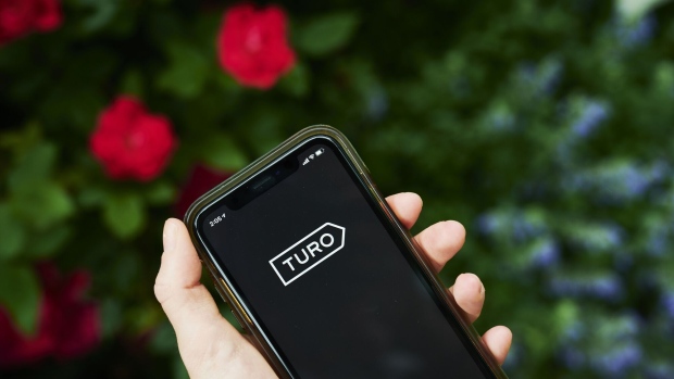 The logo for Turo Inc. is displayed on a smartphone in an arranged photograph taken in the Brooklyn borough of New York, U.S., on Thursday, June 11, 2020. Car-sharing platforms, which have suffered during the Covid-19 lockdown, see an opportunity emerging: an increase in short-distance, local trips as U.S. consumers look for a different way of getting to work and running errands. Photographer: Gabby Jones/Bloomberg
