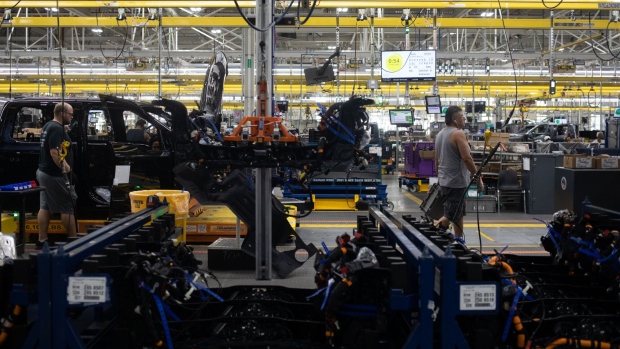 Workers on the Ford F-150 Lightning production line at the Ford Motor Co. Rouge Electric Vehicle Center (REVC) in Dearborn, Michigan, US, on Thursday, Sept. 8, 2022. Treasury Secretary Yellen outlined some of the Biden administration's unfinished economic business in a speech today calling for higher tax rates on the rich and on companies to help pay for social spending.