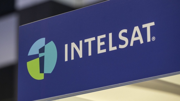 Signage of Intelsat at the company's booth at the Aviation Festival Asia 2023 in Singapore, on Tuesday, Feb. 28, 2023. The event runs through March 1. Photographer: Edwin Koo/Bloomberg