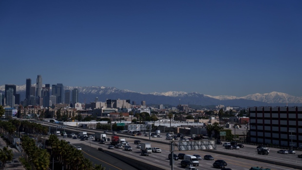 The snow-covered San Gabriel mountain range past the downtown Los Angeles skyline after a winter storm in Los Angeles, California, US, on Thursday, March 2, 2023. A sprawling winter storm last week put a substantial dent in California's historic water shortage with less than half of its land now in drought for the first time since 2020. Photographer: Eric Thayer/Bloomberg