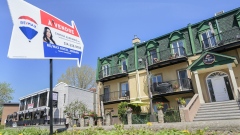 A “for sale” sign in Montreal. Most Canadians would accept a decrease in housing prices, a new Nanos Research poll for Bloomberg finds.
