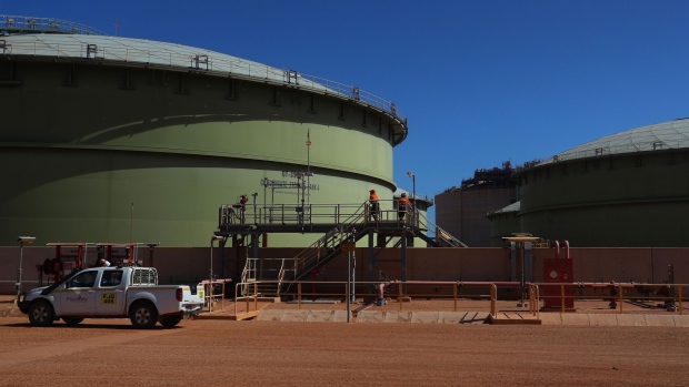The liquified natural gas (LNG) tanks at the Gorgon LNG and carbon capture and storage (CCS) facility, operated by Chevron Corp., at Barrow Island, Australia, on Monday, July 24, 2023. Chevron received approval to develop the site into a major liquefied natural gas export facility on the basis they could capture and store 80% of the CO2 mixed in with the fuel, instead of releasing it. Photographer: Lisa Maree Williams/Bloomberg