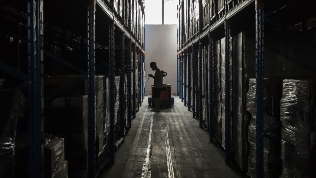 An employee at a Xinxuan Group logistics center in Guangzhou, China, on Wednesday, Sept. 21, 2022. E-commerce company Xinxuan Group was founded by Xin Youzhi, the livestreamer known as Simba, with more than 95 million followers on Kuaishou Technology's video app. Photographer: Qilai Shen/Bloomberg
