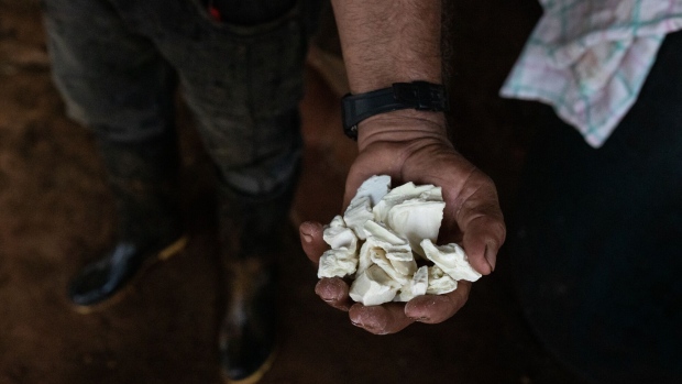 A worker holds coca paste in La Paz, Guaviare department, Colombia