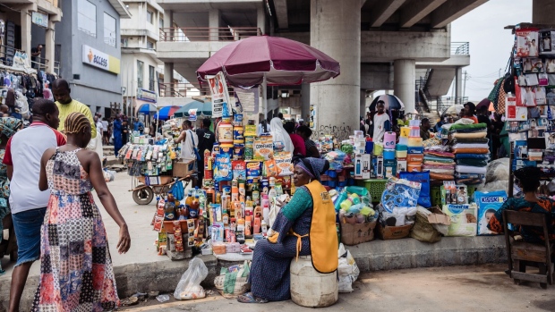A trader displays her wares at Yaba market in Lagos, Nigeria, on Monday, July 17, 2023. Nigeria’s monthly inflation rate soared to a seven-year high in June, after President Bola Tinubu scrapped fuel subsidies and allowed the currency to weaken before declaring a state of emergency to control staple food costs.