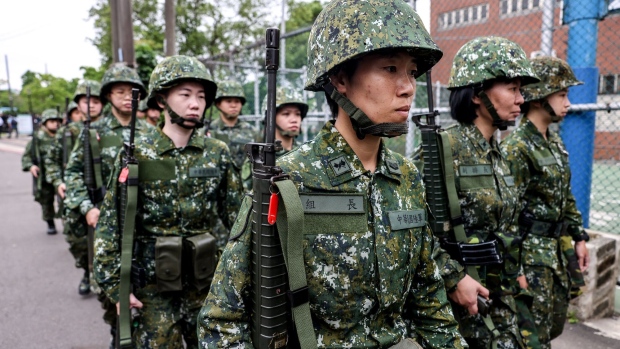 Members of Taiwan's military reserve force march during a training exercise in Taoyuan, Taiwan, on Tuesday, May 9, 2023. Taiwan has found itself under increasing pressure from Beijing, which views the self-governing island as part of its territory.