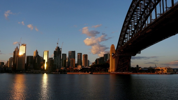 The Sydney Harbor Bridge and the skyline of the central business district (CBD) from the Milsons Point suburb of Sydney, Australia, on Tuesday, Sept. 28, 2021. Australian household spending declined for a third consecutive month as the delta variant of coronavirus swept the east coast and nation’s largest cities. Photographer: Lisa Maree Williams/Bloomberg
