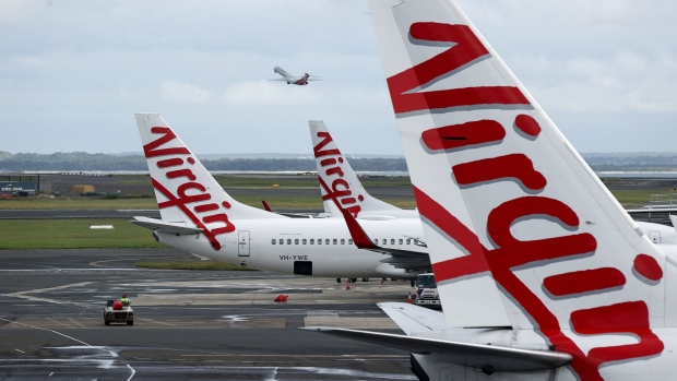 Virgin Australia aircraft at Sydney Airport. Photographer: Brendon Thorne/Bloomberg