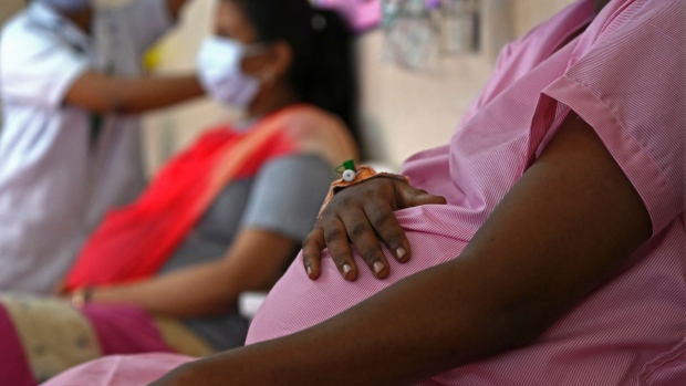 Pregnant women wait for their turn to get inoculated with dose of the Covaxine vaccine against the Covid-19 coronavirus at a government maternity and child hospital in Chennai on July 5, 2021.  Photographer: Arun Sankar/AFP/Getty Images