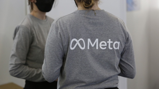 Company representatives wear branded t-shirts at the Meta Platforms Inc. area on the opening day of the MWC Barcelona at the Fira de Barcelona venue in Barcelona, Spain, on Monday, Feb. 28, 2022. Over 1,800 exhibitors and attendees from 183 countries will attend the annual event, which runs from Feb. 28 to March 3.