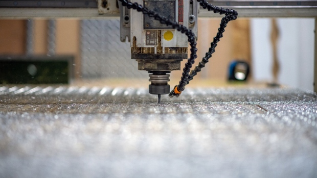 An automated CNC machine cuts diamond plate metal at a fabrication and welding shop in Langford, British Columbia, Canada, on Thursday, Feb. 10, 2022. Statistics Canada (STCA) is scheduled to release manufacturing sales figures on February 17.