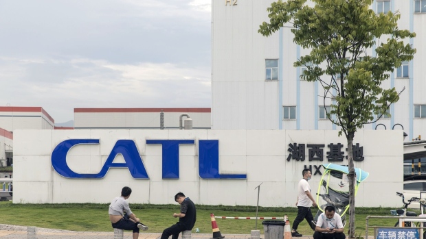 Employees sit in front of the Contemporary Amperex Technology Co. (CATL) Huxi production facility in Ningde, Fujian province, China, on Wednesday, June 3, 2020. CATL's battery products are in the vehicles of almost every major global auto brand, and starting this month they'll also power electric cars manufactured by Tesla at its factory on the outskirts of Shanghai. Photographer: Qilai Shen/Bloomberg