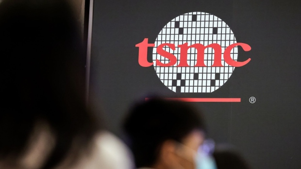 Signage for Taiwan Semiconductor Manufacturing Co. (TSMC) during the company's annual shareholder meeting in Hsinchu, Taiwan, on Tuesday, June 6, 2023. TSMC's capital expenditure for 2023 will wind up closer to $32 billion, approaching the lower end of a forecast range as it grapples with a persistent chip demand slump. Photographer: I-Hwa Cheng/Bloomberg