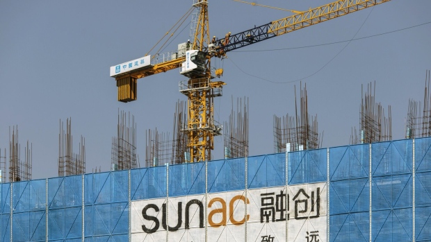 Signage at the construction site of the Sunac Resort project, developed by Sunac China Holdings Ltd., in Haiyan, Zhejiang Province, China, on Friday, Feb. 25, 2022. A widely-anticipated push by China's government to boost construction in order to stabilize growth in the world's second-largest economy has yet to materialize, a blow to hopes that Chinese stimulus would lift global growth early on this year. Photographer: Qilai Shen/Bloomberg