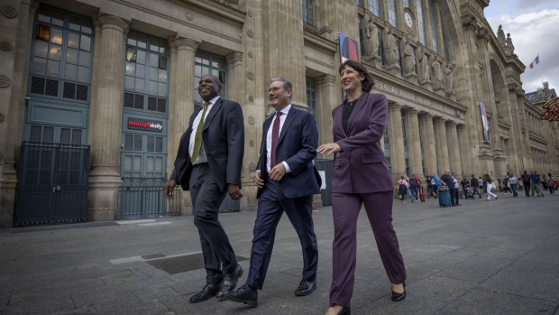 Keir Starmer, center, Rachel Reeves, right, and David Lammy in Paris on Sept. 19. Photographer: Kiran Ridley/Getty Images