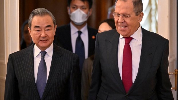 Russian Foreign Minister Sergei Lavrov and China's Director of the Office of the Central Foreign Affairs Commission Wang Yi enter a hall during a meeting in Moscow on February 22, 2023. Photographer: Alexander Nemenov/AFP/Getty Images