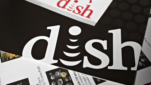 Dish Network Corp. instructional guides are arranged for a photograph in Princeton, Illinois, U.S., on Friday, July 26, 2019. The U.S. Justice Department approved T-Mobile US Inc.'s acquisition of Sprint Corp., a deal it rejected under the previous administration, clearing one of the biggest hurdles to a takeover that will reshape the wireless industry. T-Mobile and Sprint agreed to sell multiple assets to Dish Network as a condition for approval.