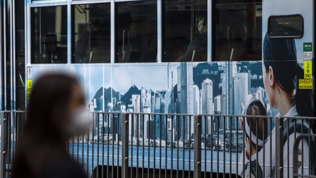 A tram featuring an advertisement with the city's skyline in Hong Kong, China, on Tuesday, Feb. 15, 2022. Hong Kong’s leader said the city had no plans for a citywide lockdown to help bring cases back to zero, even as she acknowledged that a growing omicron outbreak has exceeded its capacity to respond. Photographer: Paul Yeung/Bloomberg