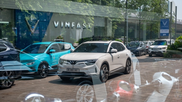 VinFast Auto Ltd. electric vehicle VF8 model at the company's showroom in Hanoi, Vietnam, on Thursday, Sept. 7, 2023. VinFast is one of Vietnam’s most high-profile companies, backed by the country’s wealthiest man Pham Nhat Vuong — who has established Vingroup JSC, a conglomerate spanning homes, hotels, hospitals and shopping malls. The group, together with its affiliates and lenders, have deployed $8.2 billion to fund VinFast’s operating expenses and capital expenditures the last six years.