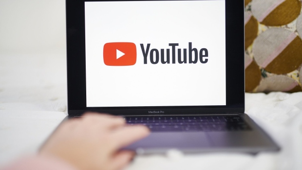 The logo for YouTube Inc. is displayed on a laptop computer in an arranged photograph taken in the Brooklyn borough of New York, U.S., on Sunday, May 10, 2020. The video arm of Alphabet Inc.'s Google is offering new tools and audience statistics specifically for advertising on TV - screen space where YouTube has trailed cable channel.